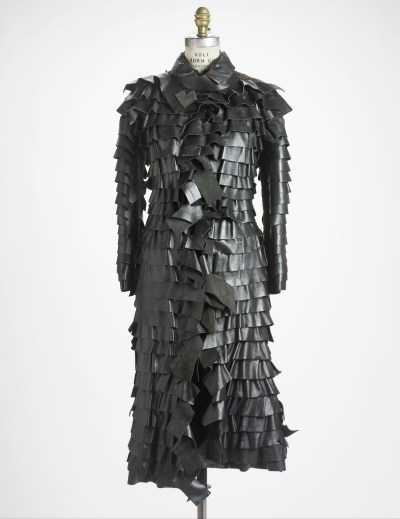 A coat made from pleated layers of leather strips.
