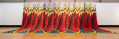 A long weaving resembling a colorful mountain range.