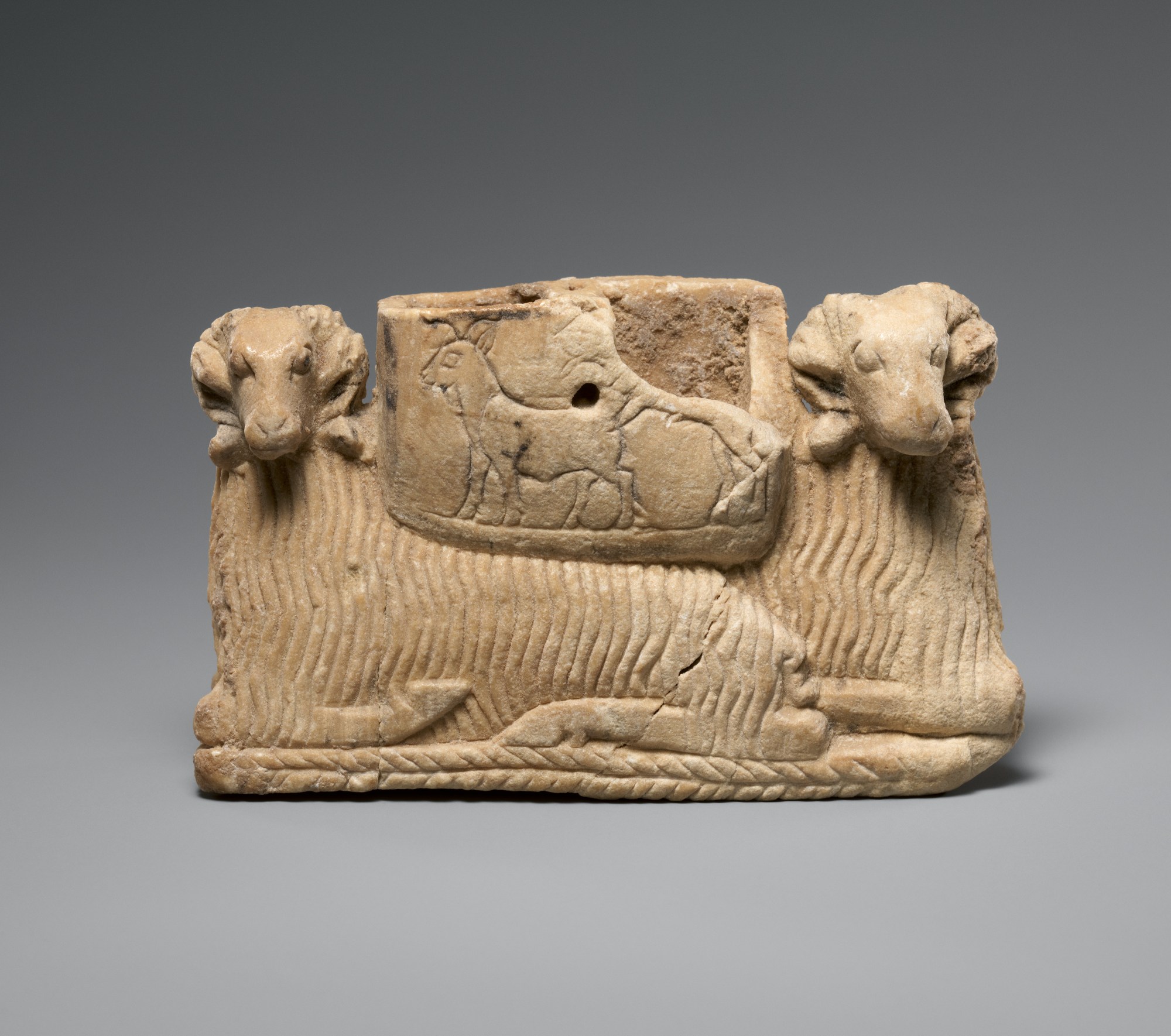 Vessel supported by two rams
Early Dynastic IIIa
ca. 2600
–
2500 BCE
Mesopotamia
Sumerian
Gypsum alabaster
H. 2 3/4 x W. 4 5/8 x D. 1 3/16 in. (7 x 11.8 x 3 cm)
Gift of Norbert Schimmel Trust, 1989