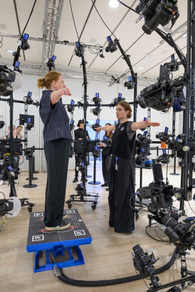Two women in a full-body scanner.