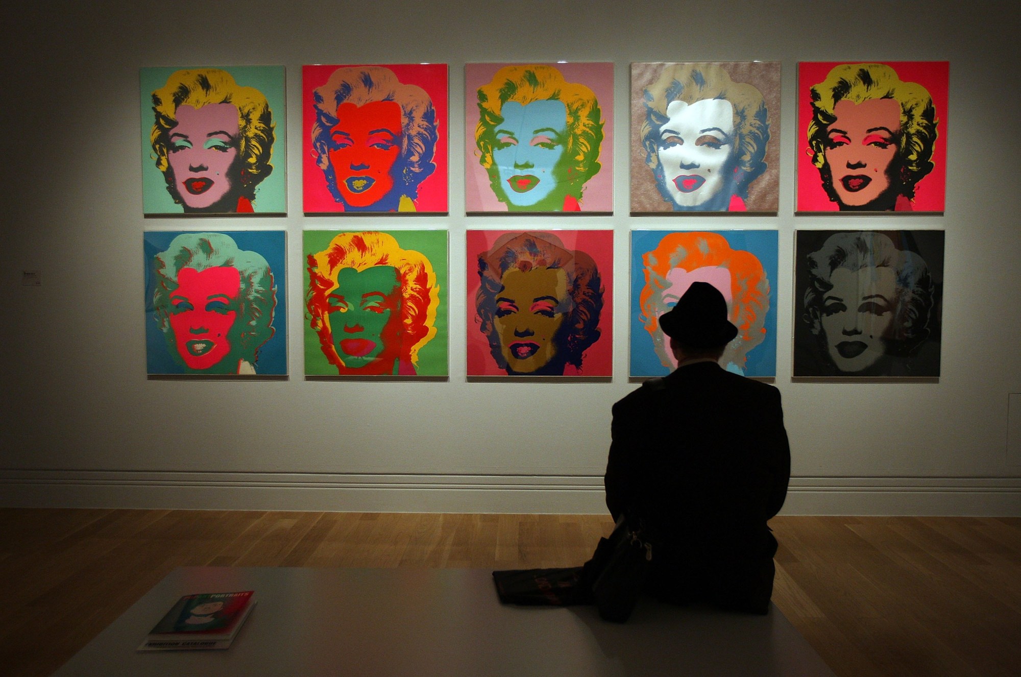 LONDON - OCTOBER 10:  A visitor to the Pop Art Portraits exhibition at National Portrait Gallery looks at Andy Warhol's  'Marilyn Monroe (Marilyn) 1967'  on October 10, 2007 in London. 52 key works by 28 American and British artists are gathered together in the first exhibition entirely devoted to portraits by pop artists. The exhibition runs from October 11, 2007 to January 20, 2008.  (Photo by Peter Macdiarmid/Getty Images)