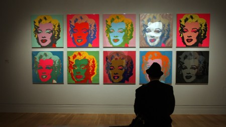 LONDON - OCTOBER 10:  A visitor to the Pop Art Portraits exhibition at National Portrait Gallery looks at Andy Warhol's  'Marilyn Monroe (Marilyn) 1967'  on October 10, 2007 in London. 52 key works by 28 American and British artists are gathered together in the first exhibition entirely devoted to portraits by pop artists. The exhibition runs from October 11, 2007 to January 20, 2008.  (Photo by Peter Macdiarmid/Getty Images)