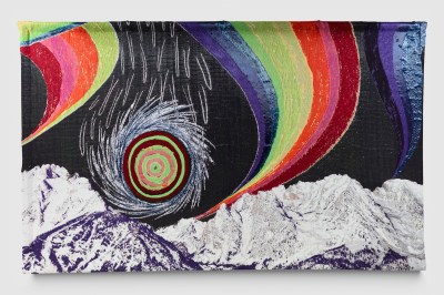 A textile showing a mountain range beneath a swirling sun and rainbows.