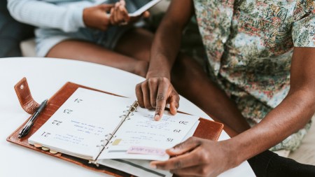 Man looking at his weekly planner
