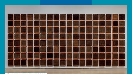 A grid of baked brown bricks on a wall.