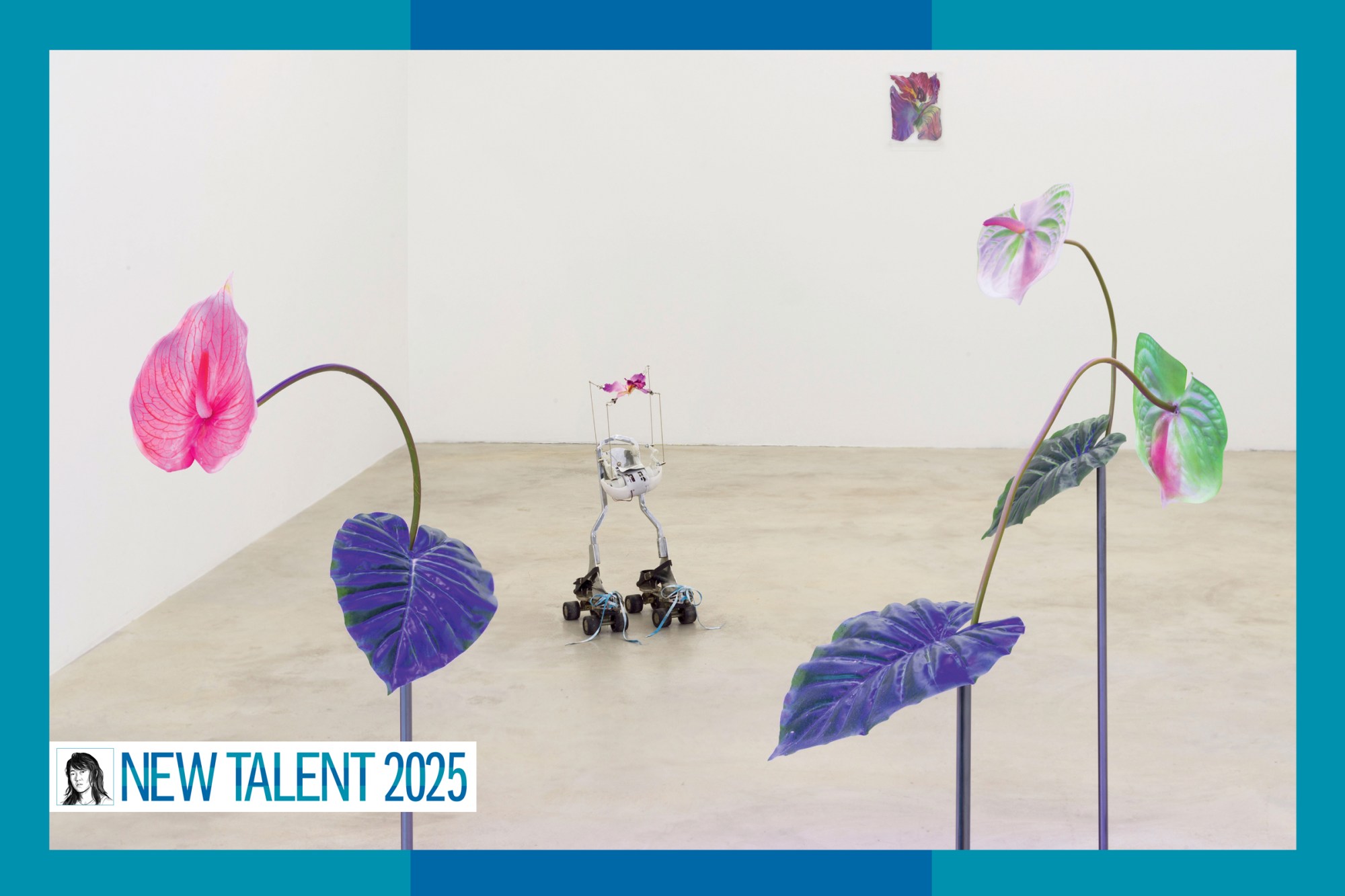 A mechanical sculpture on roller skates between two colorful fake plants.