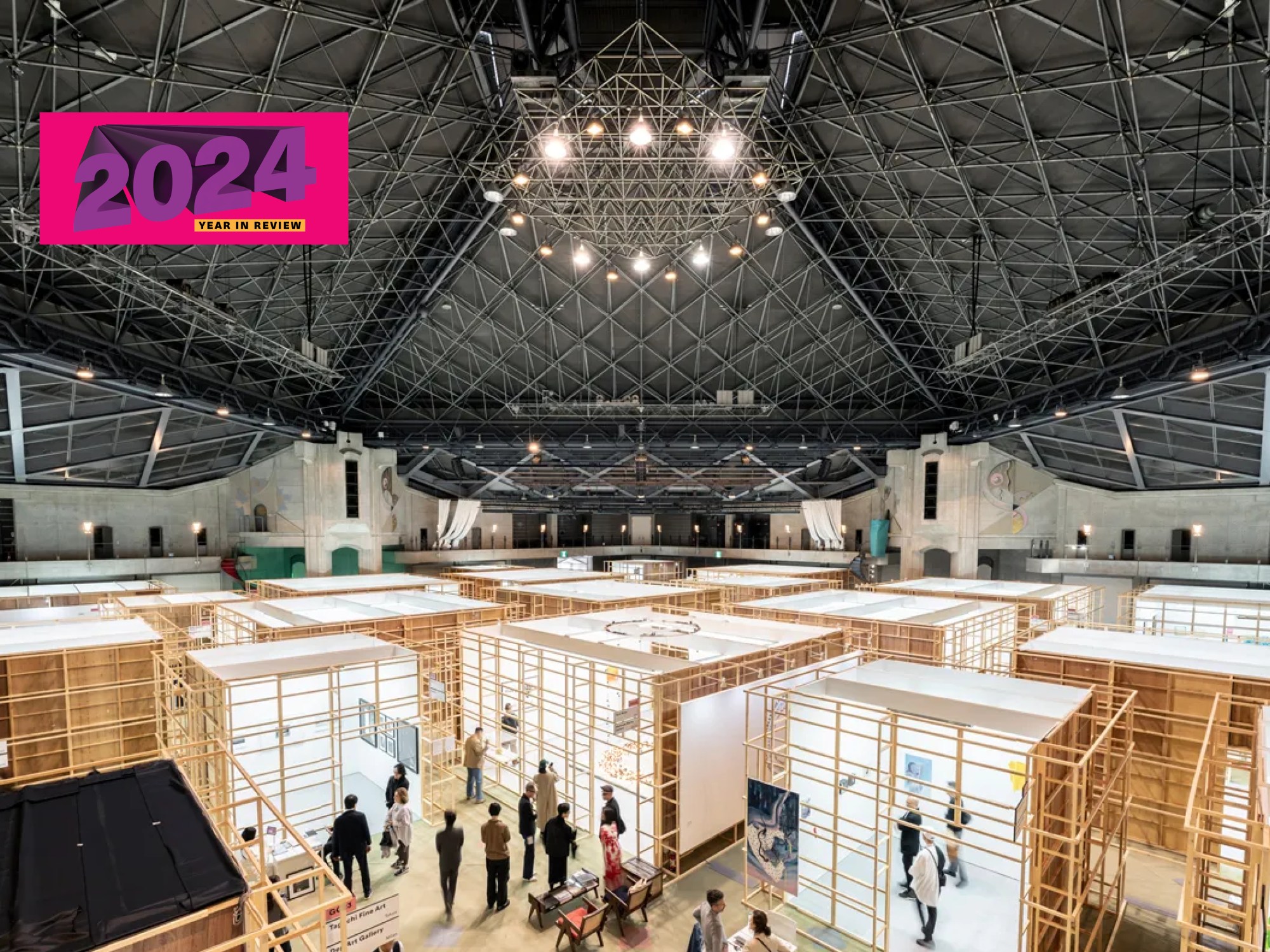 Aerial view of an art fair with box-like booths with wooden structures visible.
