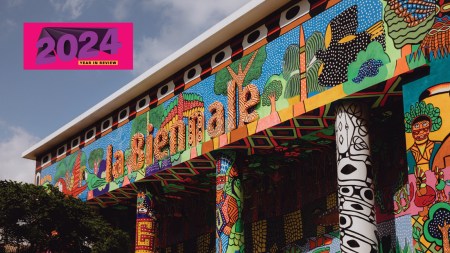A mural by MAKHU on the façade of the Venice Biennale's Central Pavilion. MAKHU (Movimento dos Artistas Huni Kuin) or the Huni Kuin Artists Movement, painted the story of kapewë pukeni (the alligator bridge). The organization was founded in Kaxinawá (Huni Kuin) Indigenous Territory, Acre, in Brazil in 2013 and was among many Indigenous artists from multiple countries featured at this year's central exhibition at the Venice Biennale.