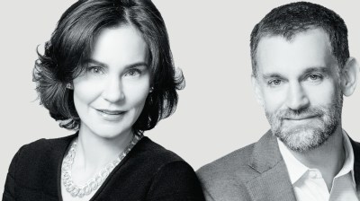 Black-and-white portrait of a white woman and white man.