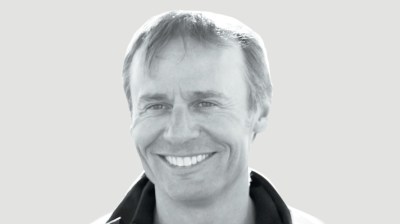 Black-and-white portrait of a middle-aged white man.