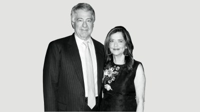 Black-and-white portrait of a white man and white woman.