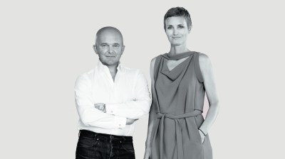 Black-and-white portrait of a short white man and a taller white woman
