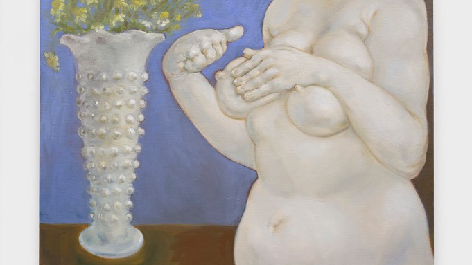 A white skinned plump figure awkwardly holds one breast. On a table behind her, a vase holds flowers.