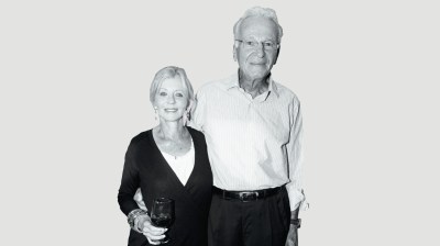 Black-and-white portrait of a white woman and a tall elderly man