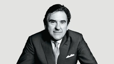 Black-and-white portrait of a middle-aged man in a suit