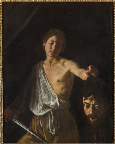 Dramatically lit paintinf of a pan in a sword and half a shirt holding a decapitatecd head, eyes open and mouth agape.
