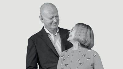 Black-and-white portrait of older white man and woman looking at each other