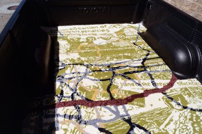 A tufted rug showing the history of the 91 Freeway in Southern California. 