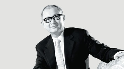 Black-and-white portrait of an elderly Asian man