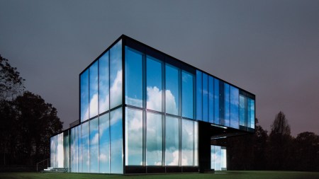 View of a projection of clouds on a glass building.