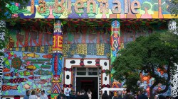 A pavilion says "la biennale" and is painted with a colorful landscape.