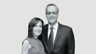 Black-and-white portrait of a middle-aged white woman and middle-aged white man
