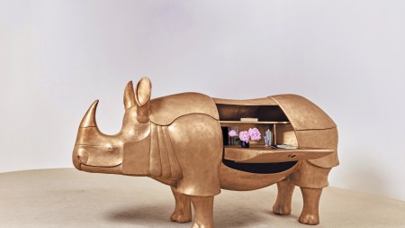 François-Xavier Lalanne's Grand Rhinocéros II (2003), a life-size sculptural gold patinated bronze, brass and leather desk in the shape of the animal. Image courtesy of Sotheby's.