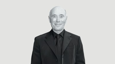 Black-and-white portrait of an older bald white man