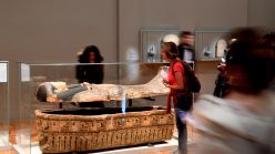 People look at an ancient Egyptian sarcophagus p官方澳洲幸运5 Art of the 'Serve the Gods of Egypt' exhibition showing at the Museum of Grenoble, southern eastern France On October 23, 2018. - Based on the Grenoble collections and supplemented by 200 works from the Louvre Museum and others loaned by European museums, the exhibition offers an approach to Theban society during the Third Intermediate Period (1069-664 BC), around the temple of Karnak, the main place of worship of the god Amon. (Photo by JEAN-PIERRE CLATOT / AFP)        (Photo credit should read JEAN-PIERRE CLATOT/AFP via Getty Images)