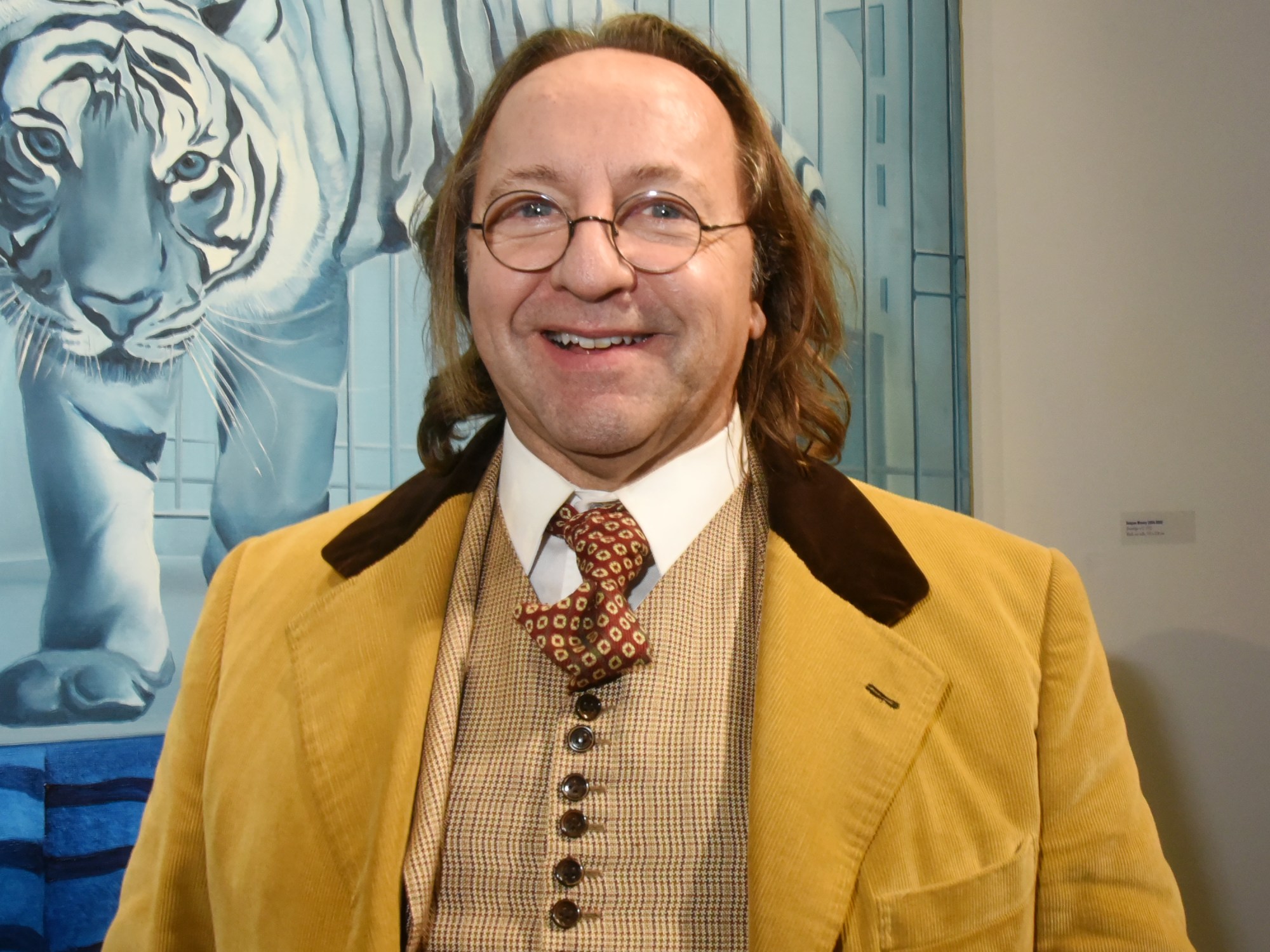 PARIS, FRANCE - NOVEMBER 20: Bill Pallot poses in front of a work of Jacques Monory (Tiger dream) during  "69 Annee Erotique" Exhibition preview at T&L Galerie X 24 Beaubourg Galerie and After Party at Les Bains Paris November 20, 2019, in Paris, France. (Photo Foc Kan/WireImage)