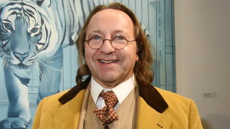 PARIS, FRANCE - NOVEMBER 20: Bill Pallot poses in front of a work of Jacques Monory (Tiger dream) during  "69 Annee Erotique" Exhibition preview at T&L Galerie X 24 Beaubourg Galerie and After Party at Les Bains Paris November 20, 2019, in Paris, France. (Photo Foc Kan/WireImage)