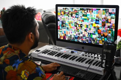 Blockchain entrepreneur Vignesh Sundaresan, also known by his pseudonym MetaKovan, showing Beeple’s Everydays: The First 5000 Days (2007–2021) at his home in Singapore, April 7, 2021