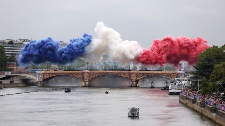 PARIS, FRANCE - JULY 26: Smoke resembling the flag of Team France is shown over Pont d’Austerlitz during the opening ceremony of the Olympic Games Paris 2024 on July 26, 2024 in Paris, France. (Photo by Lars Baron/Getty Images)