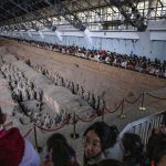 Tourists gather to see terra-cotta warriors at the Museum of Qin Terracotta Warriors and Horses in Xi'an, Shaanxi Province, China, 2025.