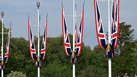 Tourists outside Buckingham Palace in St James's Park, London, England, 2025.