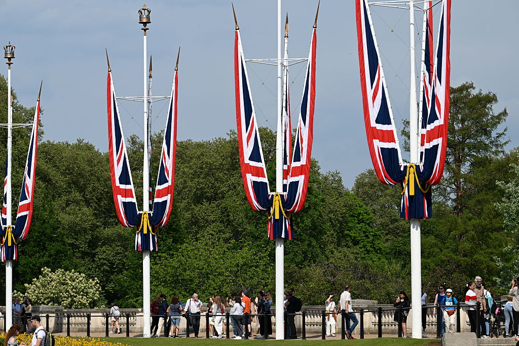 Tourists outside Buckingham Palace in St James's Park, London, England, 2025.