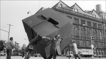 Passers-by rotate Tony Rosenthal’s Alamo (1967) in Cooper Square, New York City, October 10, 1974.