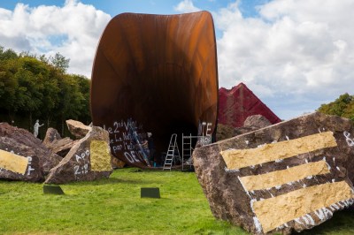 Covering antisemitic graffiti on Anish Kapoor's sculptural installation Dirty Corner (2015). with gold leaf, Versailles, France, September 21, 2015