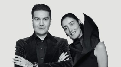 Black-and-white portrait of a middle-aged brown man and woman