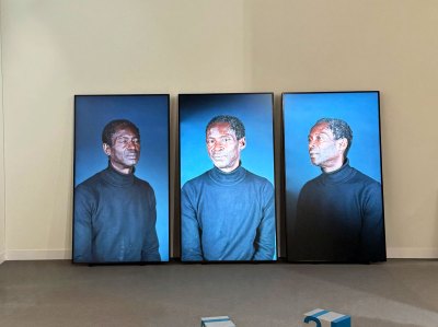 Three screens showing different views of the same Black man in a black turtleneck.