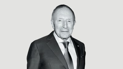 Black-and-white portrait of an older whit man in a suit