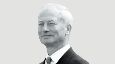 Black-and-white portrait of an older white man in a suit