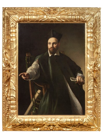 In a thick gilded frame, a man in green robes points his finger toward the painting's right edge.