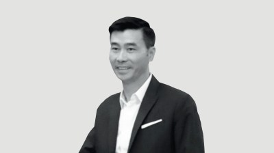 Black-and-white portrait of a young Asian man