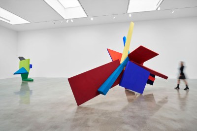Two colorful sculptures composed of intersecting planes.
