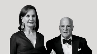 Black-and-white portrait of a tall middle-aged white woman and a shorter older white man