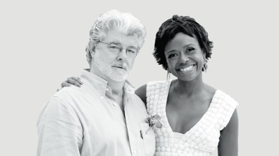 Black-and-white portrait of an older white man with a beard and a middle-aged Black woman with short hair