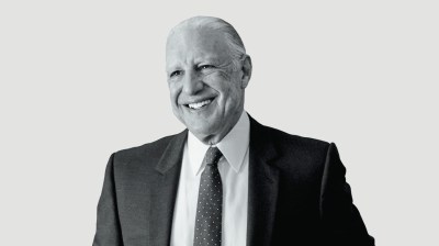 Black-and-white portrait of an older white man in a suit