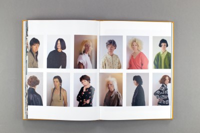 Book spread. Two grids of six photos of a septagenarian woman with a stern ace, wearing many different wigs and outfits.