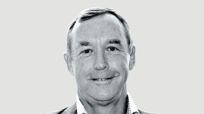 Black-and-white portrait of a young-looking middle-aged white man